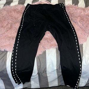 PINK Victoria Secret black track pants with PINK logo on the side.